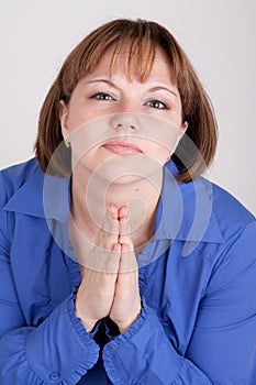 The young woman prays to god