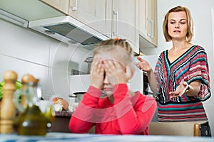 Young woman preaching little daughter