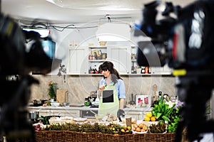 Young woman preparing for a cooking show