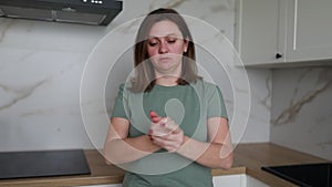 Young Woman Preparing Food in a Modern Kitchen During Daytime