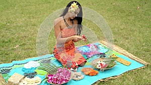 Young woman preparing garland in the garden 4k
