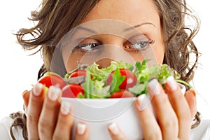 Young woman preparing healhty salad