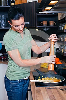 Young woman preparing lunch