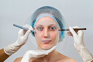 Young woman preparing for plastic surgery in cosmetic clinic
