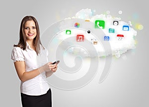 Young woman presenting cloud with colorful app icons and symbols