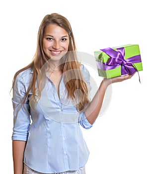 Young woman presents a christmas gift