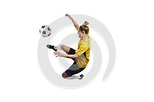 Young woman, professional female football, soccer player in motion, training, playing isolated over white background