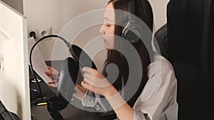 Young woman with professional microphone and headphones recording podcast at studio, technology and media