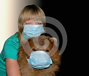 Young woman with protection mask and dog