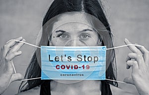 Young woman with protective surgical face mask as banner stop the spread campaign against COVID-19