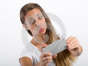 Young woman puckering up for a selfie