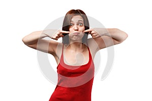 Young woman with puffed cheeks in a red shirt