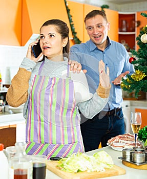 Young woman after quarrel with husband, he trying conversate