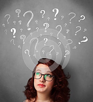 Young woman with question marks above her head