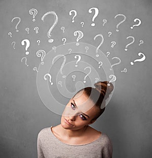 Young woman with question marks above her head