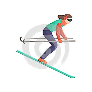 Young woman quickly skiing down the mountain