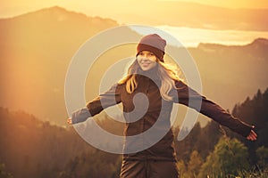 Young Woman raised hands outdoor