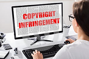 Young Woman Reading Agreement With Copyright Infringement Text