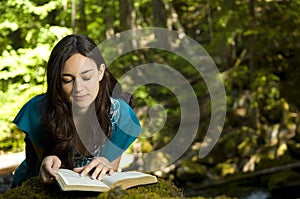 Young woman reading bible photo