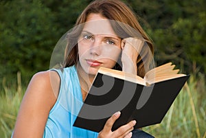 Young woman reading book