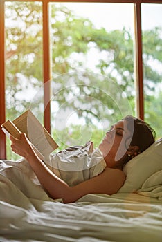 Young woman reading book