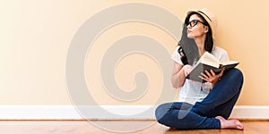 Young woman reading a book