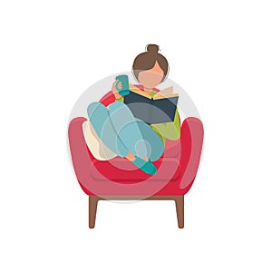 Young woman reading a book in a cozy red armchair  isolated white background