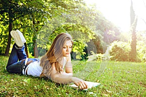 Young woman reading in park