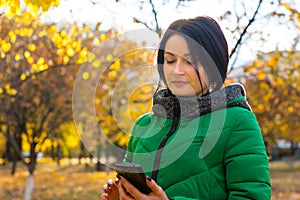 Young woman reading an sms on her mobile