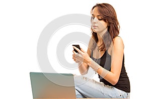 Young woman reading a text message