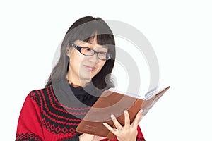Young woman reads book.