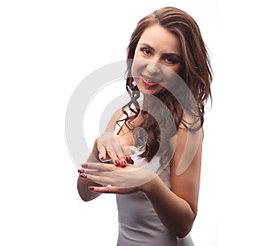 Young woman ready to put lotion for her skin, moisturizing, skin care concept