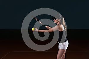 Young Woman Ready To Serves Toss Ball photo