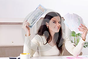 The young woman with receipts in budget planning concept