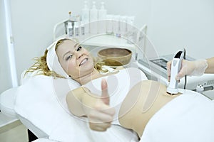 Young woman receiving epilation laser treatment