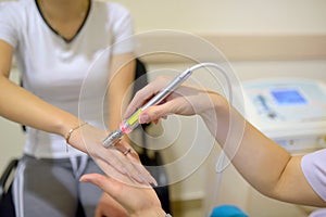 Young woman receiving laser therapy