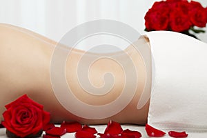 Young Woman Receiving Swedish Deep Tissue Massage Red Roses