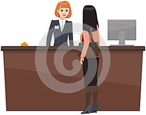 Young woman receptionist stands at reception desk. Girl booking, checking into hotel room