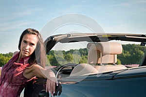 Young woman recline on the car