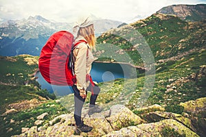 Young Woman with red backpack mountaineering