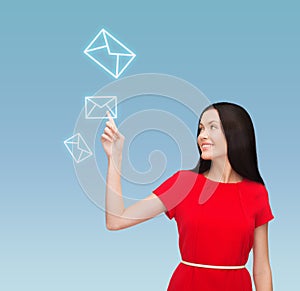 Young woman in red dress pointing her finger