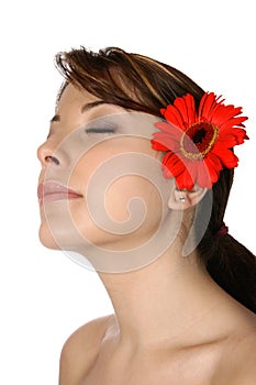 Young woman with red gerbera