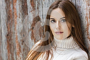Young Woman With Red Hair Wearing Jumper photo