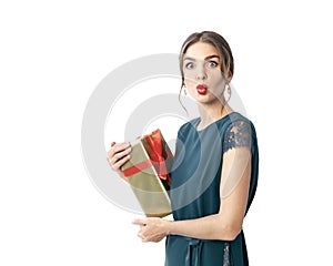 Young woman with red lipstick in formal dress hold present box make kiss grimace close up photo