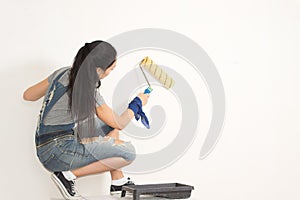 Young woman redecorating her house