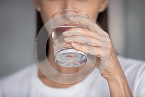 Young woman refreshing at hot summer weather.