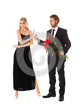 Young woman rejecting marriage proposal on white background