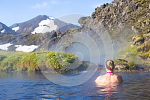 Young woman relax hot spring in Iceland