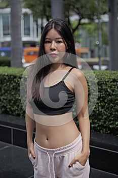 Young woman in relax leisure wear stands outdoor