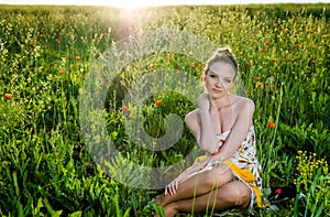 Young Woman relax in poppy field